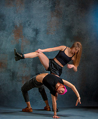 Image showing The two attractive girls dancing twerk in the studio