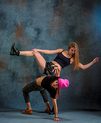 Image showing The two attractive girls dancing twerk in the studio