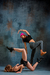 Image showing The two attractive girls dancing twerk in the studio