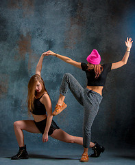 Image showing The two attractive girls dancing twerk in the studio