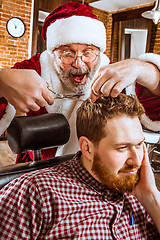 Image showing Santa claus as master at barber shop