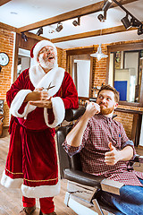 Image showing Santa claus as master at barber shop