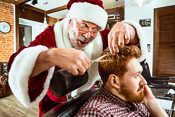 Image showing Santa claus as master at barber shop