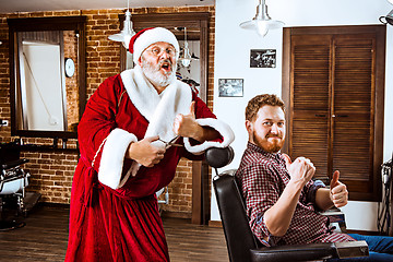 Image showing Santa claus as master at barber shop