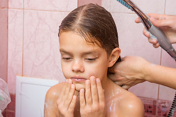 Image showing The girl thought until my mother washes her long hair