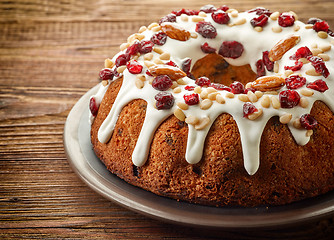 Image showing Fruit cake on wooden table