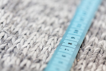 Image showing close up of knitted item with measuring tape