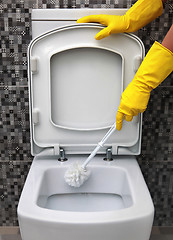 Image showing cleaning of toilet bowl 