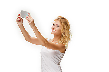 Image showing Portrait of beautiful smiling girl with modern l phone