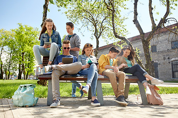 Image showing group of students with tablet pc at school yard