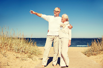 Image showing happy senior couple on summer beach