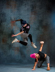 Image showing The two young girl and boy dancing hip hop in the studio