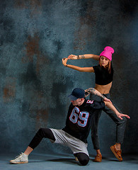 Image showing The two young girl and boy dancing hip hop in the studio