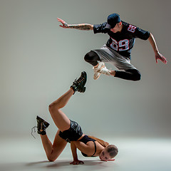 Image showing The two young girl and boy dancing hip hop in the studio