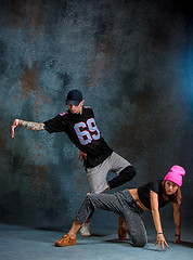 Image showing The two young girl and boy dancing hip hop in the studio