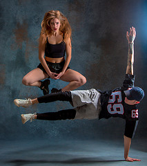 Image showing The two young girl and boy dancing hip hop in the studio