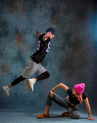 Image showing The two young girl and boy dancing hip hop in the studio