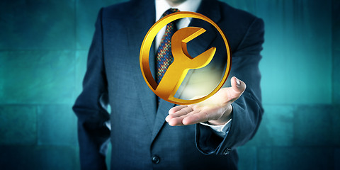 Image showing Manager Offering A Golden Circular Services Icon