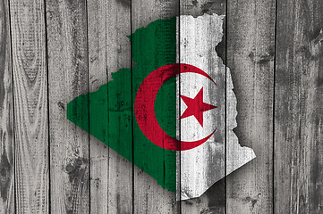 Image showing Map and flag of Algeria on weathered wood