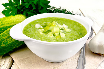 Image showing Soup cucumber with peppers in white bowl on light board