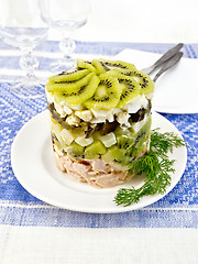 Image showing Salad of chicken and kiwi on tablecloth