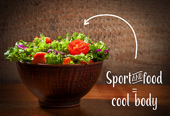 Image showing Fresh salade on wooden background