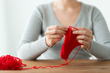 Image showing woman hands knitting with needles and yarn