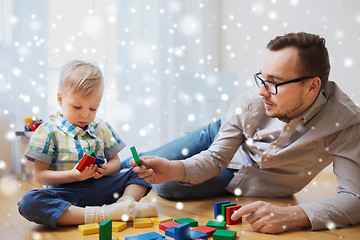 Image showing father and son playing with toy blocks at home