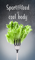 Image showing Green lettuce leaves on a fork 