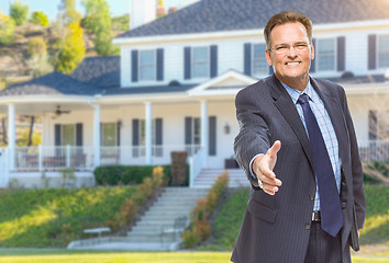 Image showing Male Agent Reaching for Hand Shake in Front of House