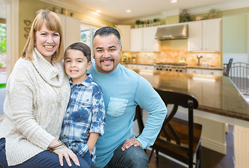 Image showing Mixed Race Young Family Inside Kitchen of House