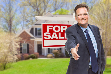 Image showing Male Agent Reaching for Hand Shake in Front of House and For Sal