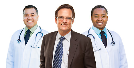 Image showing Two Mixed Race Doctors Behind Businessman  Isolated on White