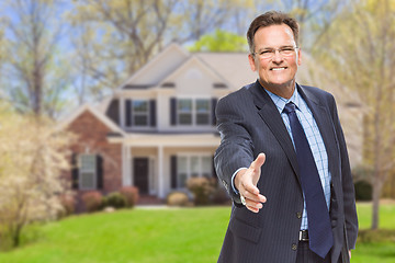 Image showing Male Agent Reaching for Hand Shake in Front of House