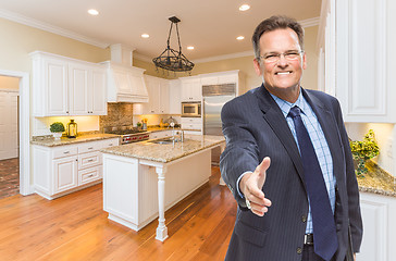 Image showing Male Agent Reaching for Hand Shake in New Kitchen