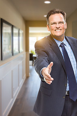 Image showing Male Agent Reaching for Hand Shake in Hallway of House