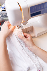 Image showing Photos of sewing-machine, hand woman