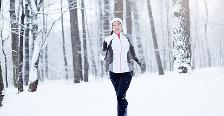 Image showing Running young brunette in sportswear