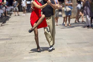 Image showing Street dancers performing tango in the street among the people