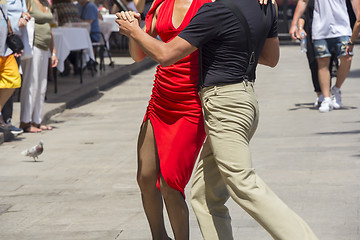 Image showing Street dancers performing tango in the street among the people