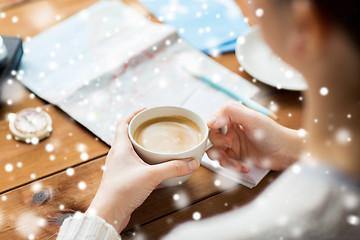 Image showing close up of hands with coffee cup and travel stuff