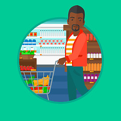 Image showing Customer with shopping trolley at supermarket.