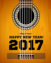 Image showing Happy New Year on the background of guitars and strings