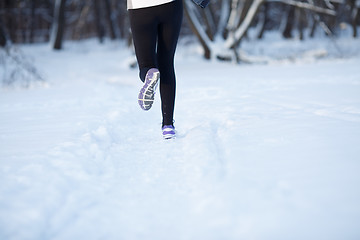 Image showing Young sportswoman engaged in running