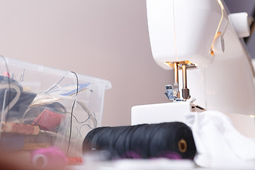 Image showing Sewing-machine close up with accessories