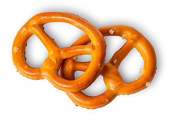 Image showing Two crunchy pretzels with salt on each other