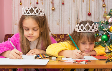 Image showing Sad Sisters write a letter to Santa Claus