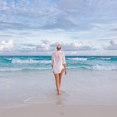 Image showing Woman on summer vacations at tropical beach of Mahe Island, Seychelles.