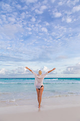 Image showing Woman enjoying Anse Lazio picture perfect beach on Mahe Island, Seychelles.