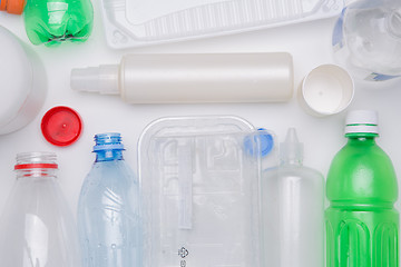 Image showing Plastic bottles on empty table